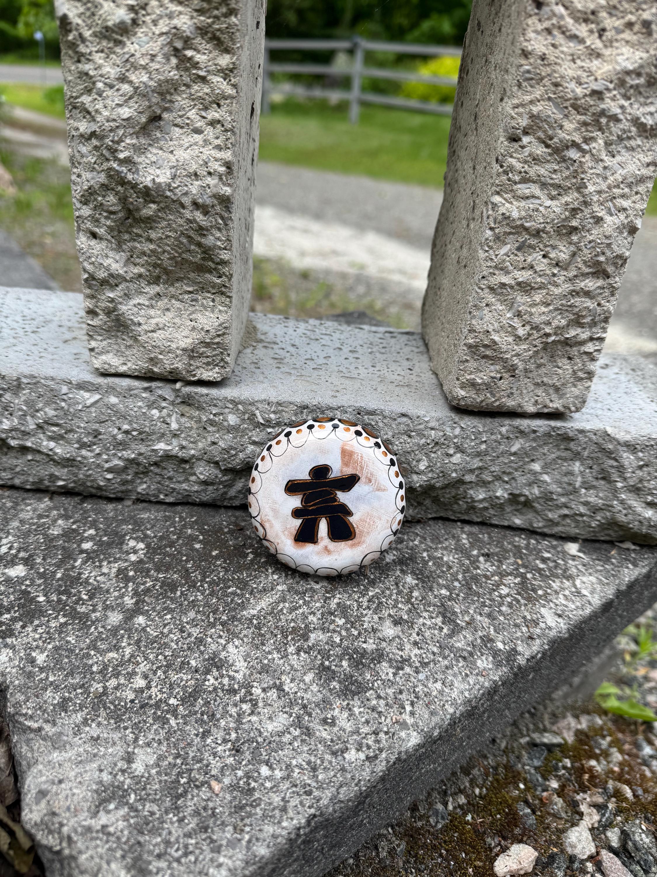 White Inukshuk Sculpture: Copper & Black Detail